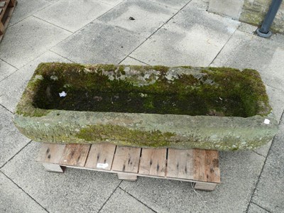 Lot 755 - A narrow rectangular stone trough, 121cm x 40cm x 22cm high