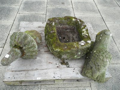 Lot 768 - A square stone trough, a stone lion and a carved stone finial