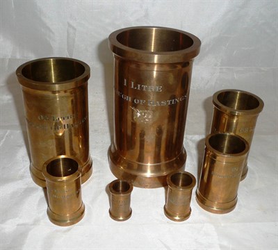 Lot 1006 - A Set of Seven Victorian 'Borough of Hastings' Lacquered Brass Measures by De Grave & Co.,...