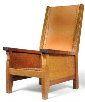 Lot 827 - A Robert  "Mouseman " Thompson Oak Smoker's Chair, with slung cow hide back and lattice seat,...