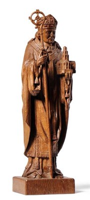 Lot 833 - A Robert  "Mouseman " Thompson Carved Oak Statue of a Bishop, holding a staff and a cathedral, with