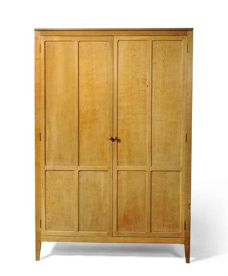 Lot 835 - A Robert 'Mouseman' Thompson Bespoke 4' Panelled Oak Wardrobe, opening to reveal a hanging rail...