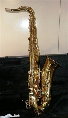 Lot 1127 - A Lacquered Brass 'Sunrise' Tenor Saxophone, with faux mother of pearl inset keys, mouthpiece...