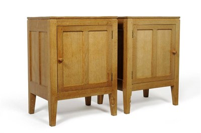 Lot 839 - A Pair of Robert  "Mouseman " Thompson Bespoke Panelled Oak Bedside Cupboards, with knob...