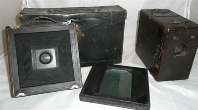 Lot 1159 - A Kodak 3A Premo No.9 Folding Plate Camera, with black leather covered wooden body, polished...