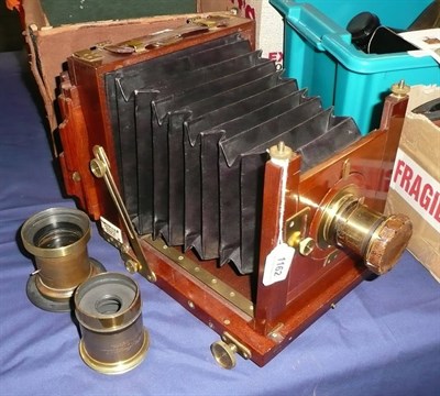 Lot 1162 - A Mahogany and Brass Half Plate Field Camera by Appleton & Co., Bradford, with tapered black...