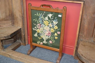 Lot 841 - A Robert  "Mouseman " Thompson Oak Firescreen, pierced hand hole, the frame inset with a vase...