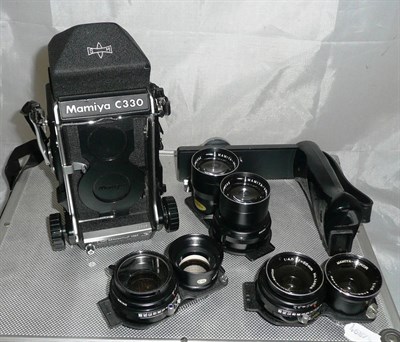 Lot 1206 - A Mamiya C330S Professional Camera Outfit, serial number W112925, with 80mm, 55mm & 135mm...