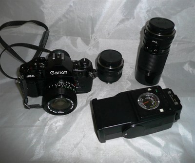 Lot 1209 - A Canon A1 Camera Outfit, comprising black camera body No.534831, FD f2.8/24mm lens, FD...