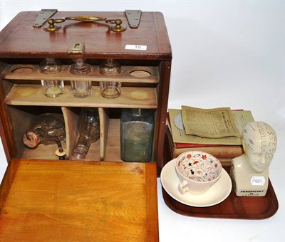 Lot 15 - An apothecary box, two glass feeders, a phrenology head and literature