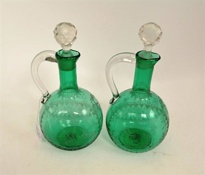 Lot 17 - A pair of green glass scratch engraved marriage decanters