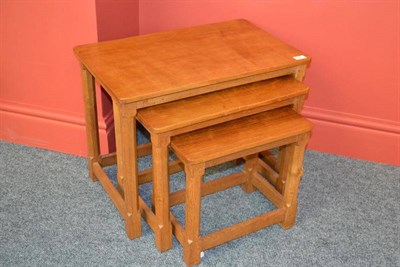 Lot 852 - A Robert  "Mouseman " Thompson Oak Nest-of-Tables, on four octagonal legs, each with carved...