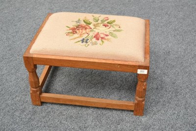 Lot 853 - A Robert  "Mouseman " Thompson Oak Low Foot Stool, upholstered tapestry top, on four octagonal...