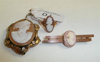 Lot 70 - A 9ct gold cameo ring and two cameo brooches