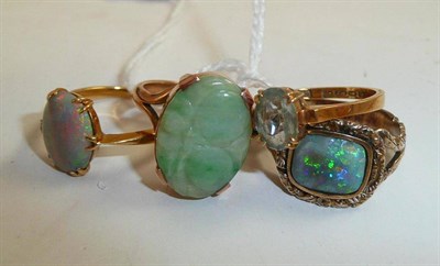 Lot 71 - Two opal set rings, one stamped 18ct, another 18ct gold ring and a jade set ring (4)