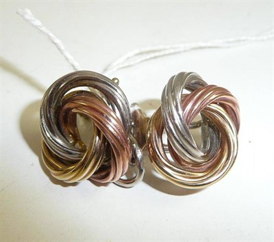 Lot 83 - A pair of three colour knot clip-on earrings stamped '9ct'