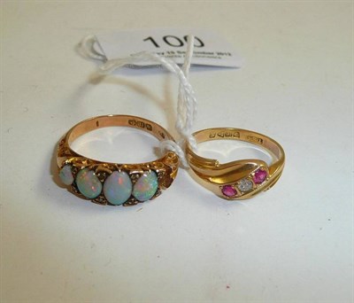 Lot 100 - An 18ct gold opal ring (one opal missing) and an 18ct gold diamond and ruby set ring (2)