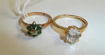 Lot 106 - A 14ct gold ring and a 9ct gold, diamond and emerald cluster ring