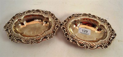 Lot 129 - A pair of embossed silver oval dishes