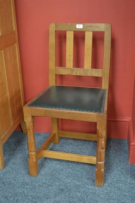 Lot 861 - A Robert  "Mouseman " Thompson Oak Slat Back Dining Chair, with dark green cow hide seat, on turned