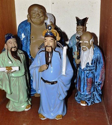 Lot 149 - Five ";Chinese"; pottery figures with glazed robes