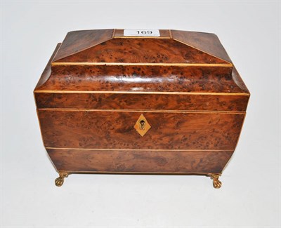 Lot 169 - A yew tea caddy with lion feet