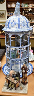 Lot 188 - Capodimonte blue and white ornamental bird cage and figure group