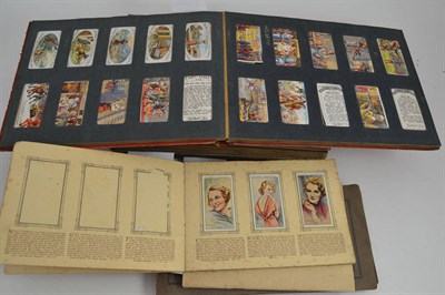 Lot 204 - Seven albums of cigarette cards