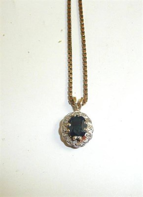 Lot 226 - A 9ct gold sapphire and diamond cluster pendant on a box link chain