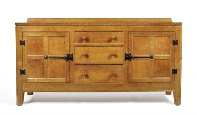 Lot 871 - A Peter  "Rabbitman " Heap 5' Panelled Oak Sideboard, with raised upstand, above three drawers...