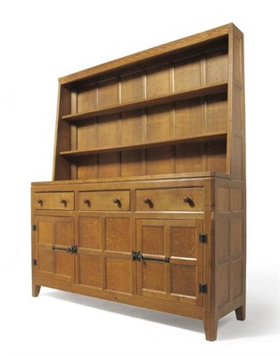 Lot 872 - A Peter  "Rabbitman " Heap Oak 5' Welsh Dresser, the upper section with two plate rack shelves, the