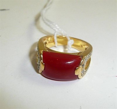 Lot 254 - A carnelian and diamond ring stamped '18K' and '750'