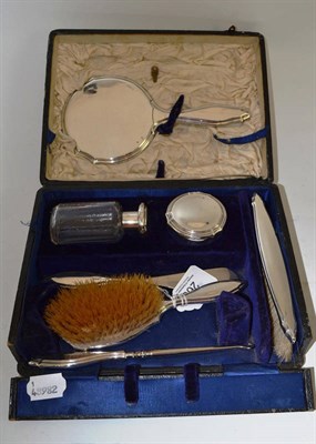 Lot 260 - A silver and glass cased dressing set