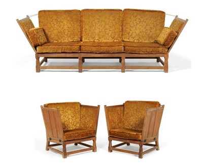 Lot 875 - A Derek "Fishman " Slater Panelled Oak Three Piece Suite, comprising a sofa, with drop-ends, on...