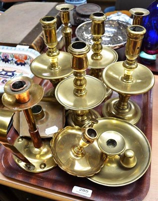 Lot 285 - Four brass candlesticks with drip trays, another pair of brass candlesticks and three chamber...