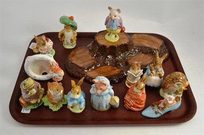 Lot 293 - Twelve Beswick Beatrix Potter models, a ";wood"; base