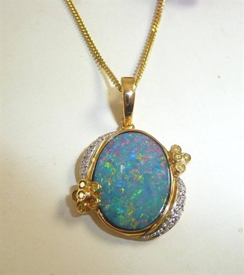 Lot 315 - A modern opal and diamond pendant on 9ct gold chain