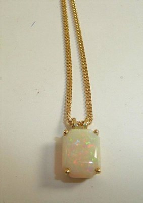 Lot 316 - An 18ct gold opal pendant on curb chain