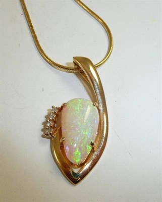 Lot 322 - An 18ct gold snake chain with an opal and diamond pendant