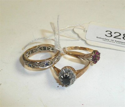 Lot 328 - An eternity ring, a ruby ring and a diamond ring (3)