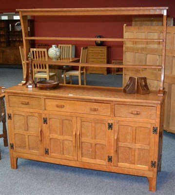 Lot 880 - A Kingpost Woodwork Oak Dresser, the plate rack with two shelves, the base with three drawers...