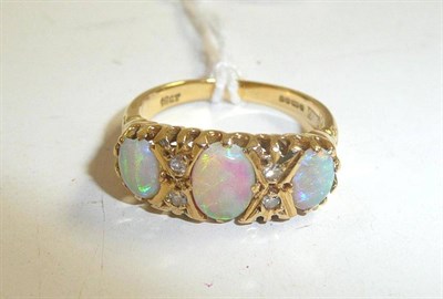 Lot 330 - An 18ct gold opal and diamond ring