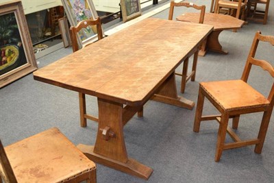 Lot 881 - A Kingpost Woodwork Oak Refectory Table, on two shaped supports joined by a stretcher, with...