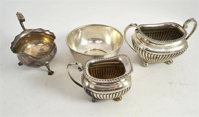 Lot 361 - A silver cream jug, a silver circular dish, a silver milk jug and silver sugar bowl