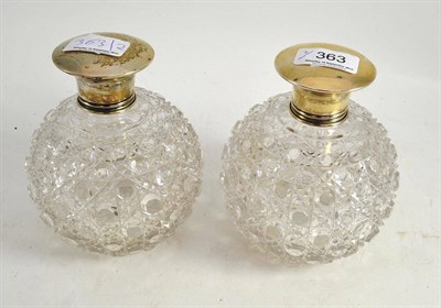 Lot 363 - Pair of large globular cut glass scent bottles with silver mounts