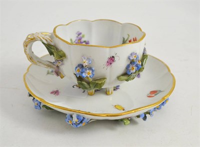 Lot 364 - Meissen cabinet cup and saucer encrusted with foliage and forget-me-nots with blue crossed...