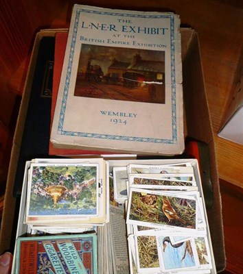 Lot 369 - A small collection of stamps and cigarette cards, together with two railway booklets