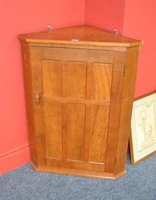 Lot 884 - A Kingpost Woodwork Oak Corner Cupboard, with panelled door, with recessed carved roof beam...