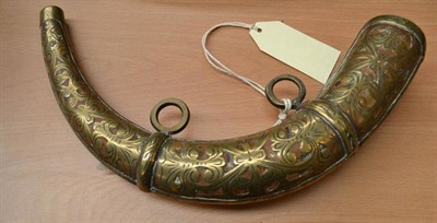 Lot 396 - A brass engraved powder horn