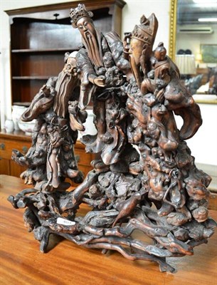 Lot 404 - An Oriental root carving of three figures